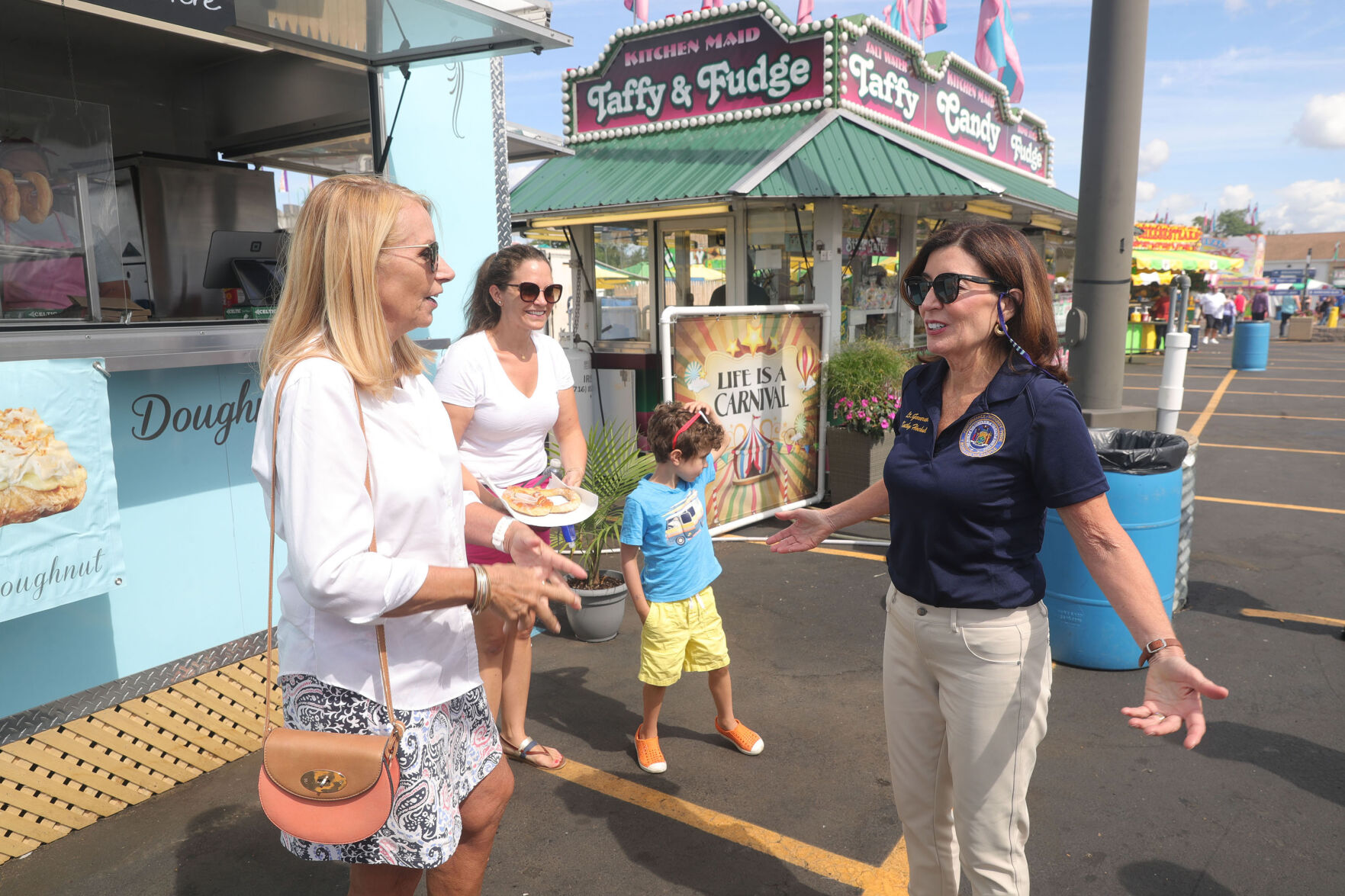 Kathy Hochul talks with the Vitrano's.